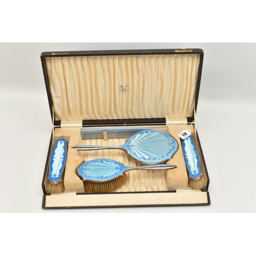 81 - A CASED SILVER AND BLUE GUILLOCHE ENAMEL VANITY SET, comprising of a hand held mirror, hair brush, t... 