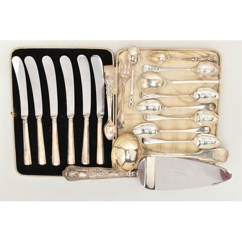 82 - A SELECTION OF SILVER CUTLERY, to include a Georgian fiddle pattern ladle, engraved crest to the ter... 