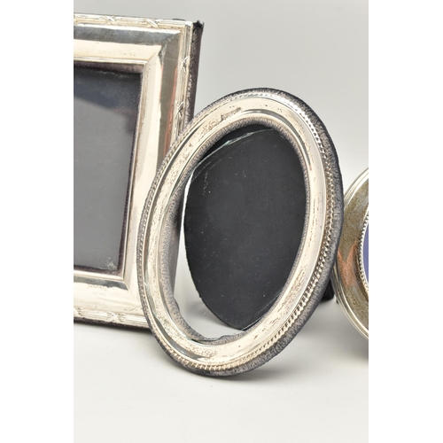 90 - THREE SILVER PHOTOGRAPH FRAMES, all of rectangular outline, to include a pair of frames, silver hall... 