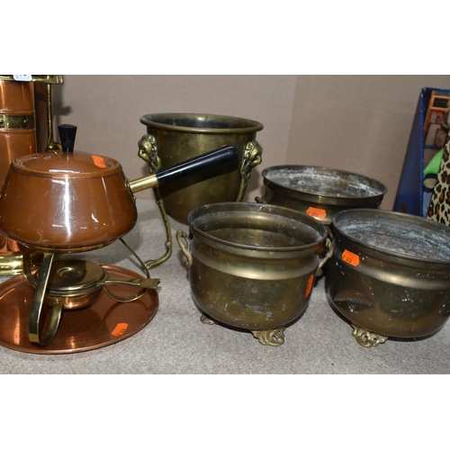 303 - A GROUP OF THIRTEEN COPPER AND BRASS MISCELLANEOUS ITEMS to include four brass footed planters to in... 