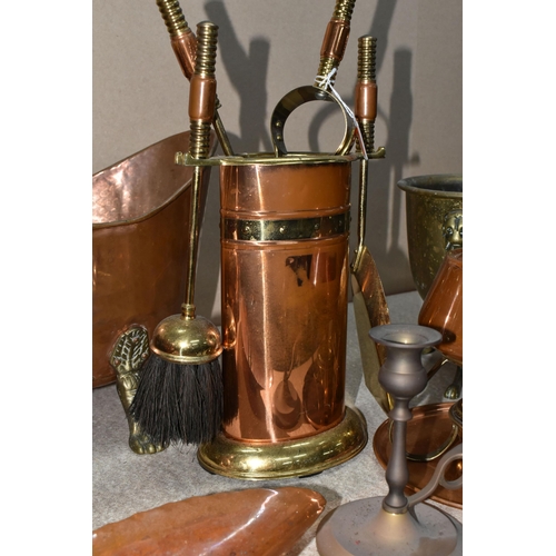 303 - A GROUP OF THIRTEEN COPPER AND BRASS MISCELLANEOUS ITEMS to include four brass footed planters to in... 