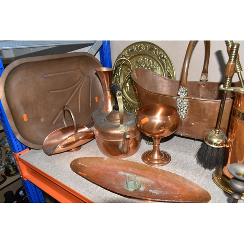 303 - A GROUP OF THIRTEEN COPPER AND BRASS MISCELLANEOUS ITEMS to include four brass footed planters to in... 