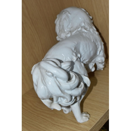 318 - A DRESDEN PORCELAIN PEKINGESE DOG FIGURE, possibly Carl Thieme, puce D backstamp, height 20.5cm x le... 