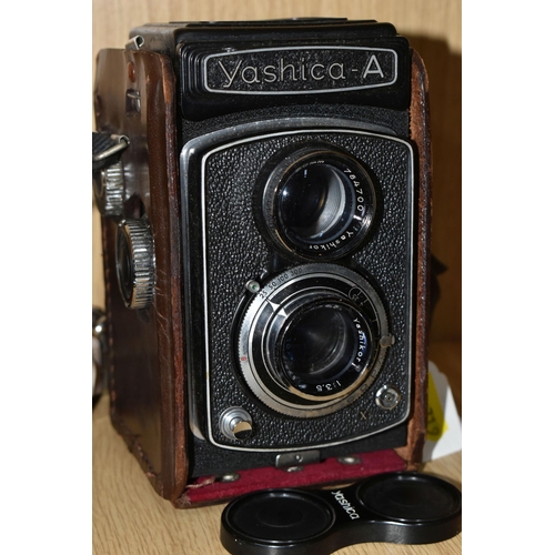 319 - TWO VINTAGE TWIN LENS CAMERAS, comprising a Yashica-A  serial No. A 8020081, with brown leather case... 