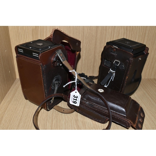 319 - TWO VINTAGE TWIN LENS CAMERAS, comprising a Yashica-A  serial No. A 8020081, with brown leather case... 