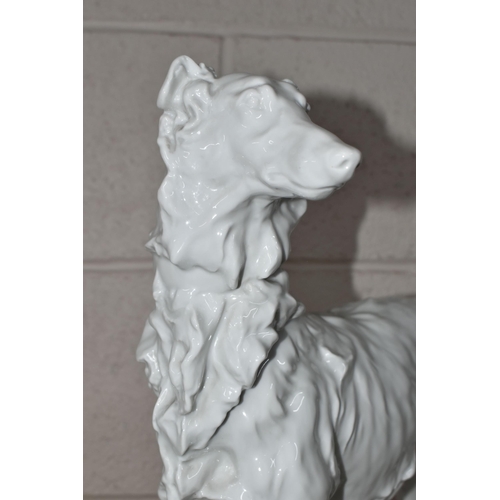 334 - A HEREND WHITE GLAZED PORCELAIN FIGURE OF A BORZOI HOUND, incised to the base Herend 5358, signed to... 