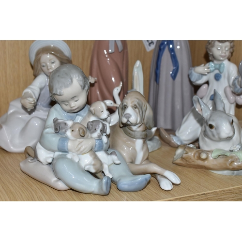 336 - A GROUP OF SIX LLADRO FIGURES AND ONE NAO FIGURE, comprising Trying on a Straw Hat, model no 5011, s... 