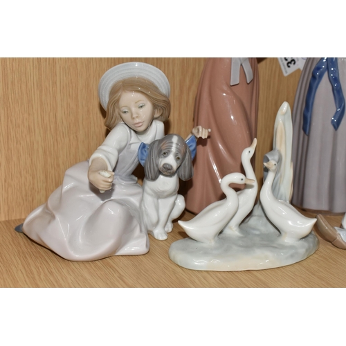 336 - A GROUP OF SIX LLADRO FIGURES AND ONE NAO FIGURE, comprising Trying on a Straw Hat, model no 5011, s... 