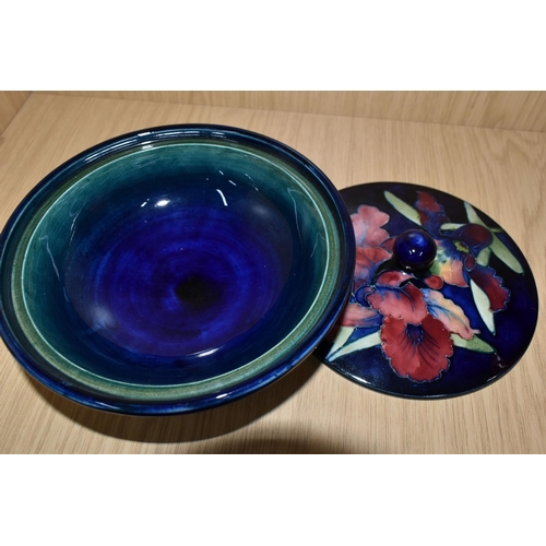 337 - A MOORCROFT POTTERY 'ORCHID' PATTERN COVERED BOWL, tube lined with pink and purple orchids on a blue... 