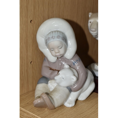 340 - A GROUP OF FOUR LLADRO FIGURES, comprising a Lladro Grés Eskimo riders, model no 2270 with wooden pl... 