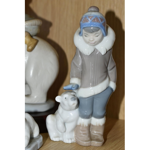 340 - A GROUP OF FOUR LLADRO FIGURES, comprising a Lladro Grés Eskimo riders, model no 2270 with wooden pl... 