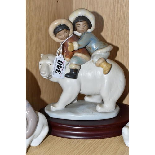 340 - A GROUP OF FOUR LLADRO FIGURES, comprising a Lladro Grés Eskimo riders, model no 2270 with wooden pl... 