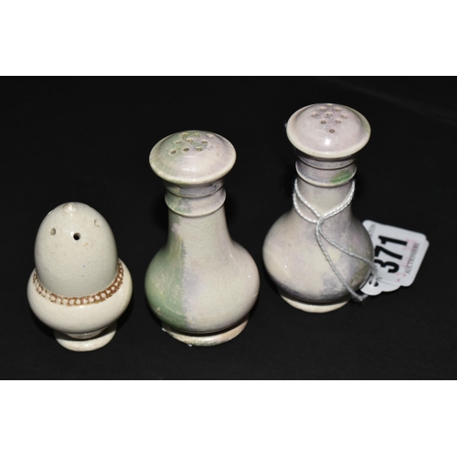 371 - THREE MOORCROFT POTTERY PEPPER POTS, one of acorn form, the other two with the remains of a green-bl... 