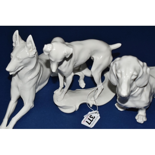 377 - A GROUP OF THREE NYMPHENBURG WHITE PORCELAIN MODELS OF DOGS, comprising a resting German Shepherd de... 