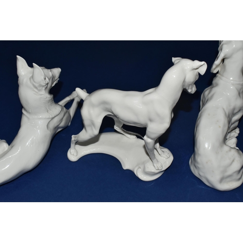 377 - A GROUP OF THREE NYMPHENBURG WHITE PORCELAIN MODELS OF DOGS, comprising a resting German Shepherd de... 