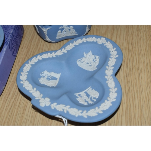 378 - FIVE PIECES OF WEDGWOOD PALE BLUE JASPERWARE, comprising a boxed Leo pin dish, a club shaped pin dis... 