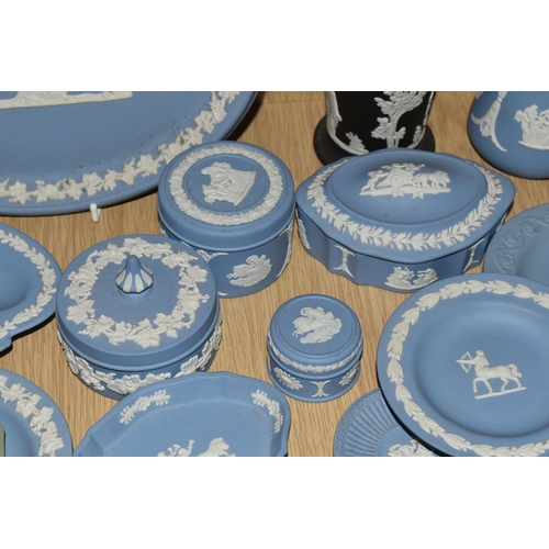 381 - A QUANTITY OF WEDGWOOD BLUE JASPERWARE, comprising an oval plaque, cabinet plate, eight trinket dish... 