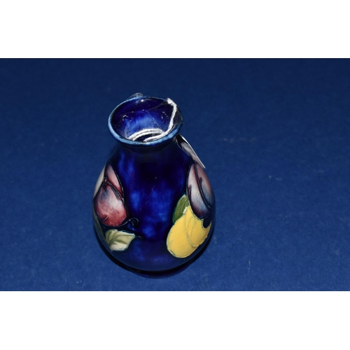 387 - A MOORCROFT POTTERY 'WISTERIA' PATTERN VASE, of small ovoid form, tube lined with purple, pink and y... 