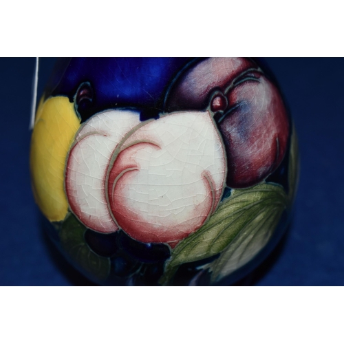 387 - A MOORCROFT POTTERY 'WISTERIA' PATTERN VASE, of small ovoid form, tube lined with purple, pink and y... 