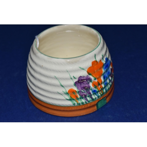 388 - A CLARICE CLIFF 'CROCUS' HONEYPOT BASE, painted with orange, blue and purple crocus flowers on a cre... 