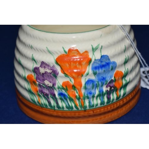 388 - A CLARICE CLIFF 'CROCUS' HONEYPOT BASE, painted with orange, blue and purple crocus flowers on a cre... 