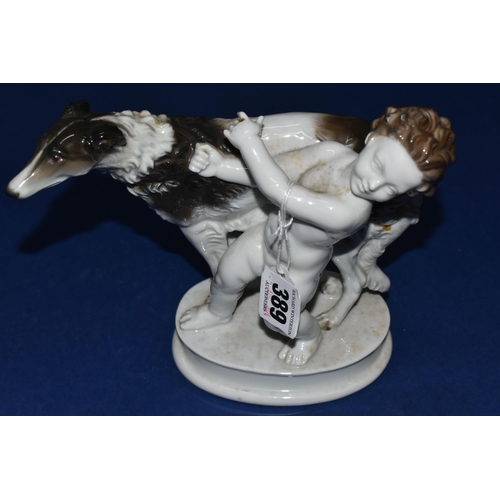 389 - A ROSENTHAL FIGURE GROUP, comprising a figure of a grey and white Borzoi being led by a cherub on a ... 