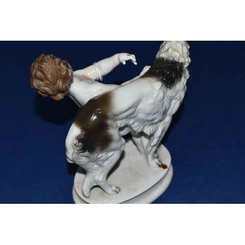 389 - A ROSENTHAL FIGURE GROUP, comprising a figure of a grey and white Borzoi being led by a cherub on a ... 