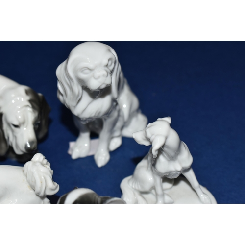 390 - A GROUP OF FIVE ROSENTHAL DOG FIGURINES, comprising a small Papillon, height 7.5cm, a seated Pekines... 