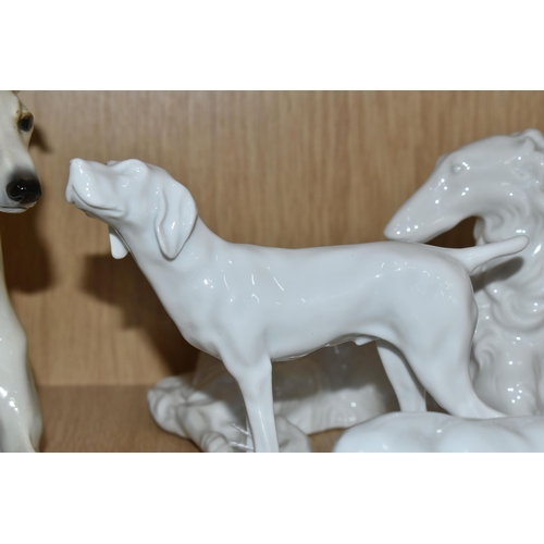 391 - A GROUP OF SIX GERMAN WHITE PORCELAIN DOGS,  comprising a Unterweissbach sleeping hound dog, signed ... 