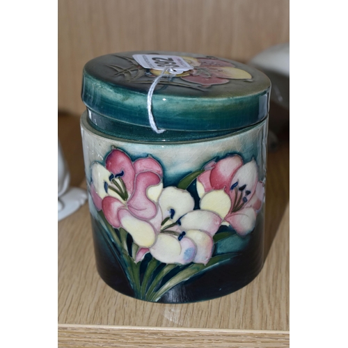 392 - A MOORCROFT POTTERY 'FREESIA' PATTERN COVERED JAR, of cylindrical form, tube lined with pale yellow ... 