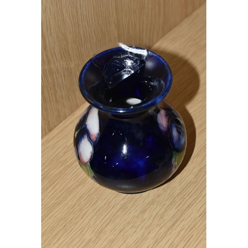 395 - A MOORCROFT POTTERY SMALL 'PANSY' PATTERN VASE, with flared neck, tube lined with purple pansies on ... 