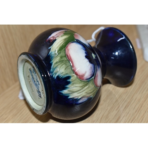 395 - A MOORCROFT POTTERY SMALL 'PANSY' PATTERN VASE, with flared neck, tube lined with purple pansies on ... 