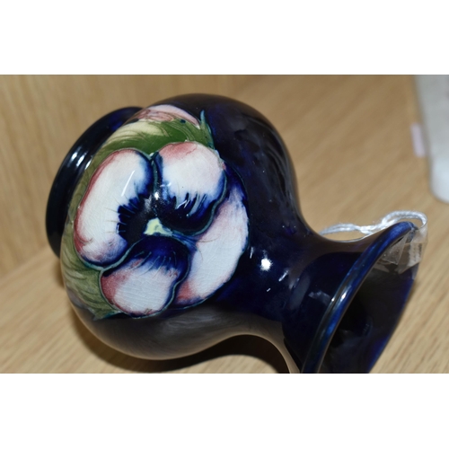 395 - A MOORCROFT POTTERY SMALL 'PANSY' PATTERN VASE, with flared neck, tube lined with purple pansies on ... 