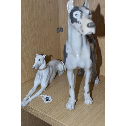 402 - TWO BING AND GRONDAHL FIGURES OF DOGS, comprising a recumbent greyhound, model no 2079, height 11cm ... 