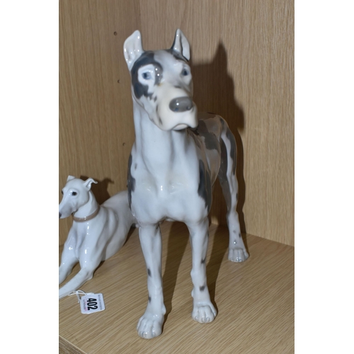 402 - TWO BING AND GRONDAHL FIGURES OF DOGS, comprising a recumbent greyhound, model no 2079, height 11cm ... 