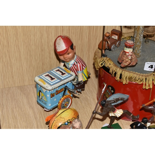 417 - A TINPLATE CLOCKWORK MUSICAL CAROUSEL, c.1930s, red painted base with transfers and canopy, wooden f... 