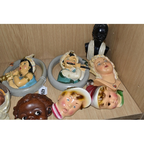 420 - A GROUP OF CHALKWARE FACE PLAQUES, to include ten face plaques and a small chalkware bust, largely m... 