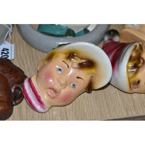 420 - A GROUP OF CHALKWARE FACE PLAQUES, to include ten face plaques and a small chalkware bust, largely m... 