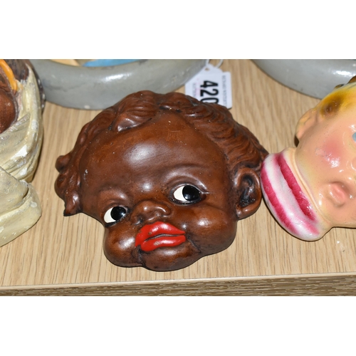 420 - A GROUP OF CHALKWARE FACE PLAQUES, to include ten face plaques and a small chalkware bust, largely m... 