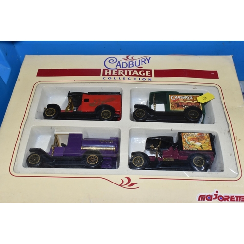 438 - A QUANTITY OF TWENTY ONE BOXED MODEL DIECAST VEHICLES, to include twelve Lledo Walkers Crisps vehicl... 