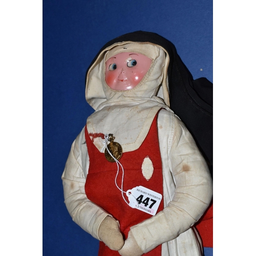 447 - A VINTAGE NURSE DOLL, painted celluloid face which has some paint loss, crush damage to nose and wea... 