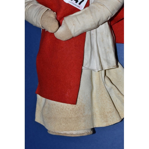 447 - A VINTAGE NURSE DOLL, painted celluloid face which has some paint loss, crush damage to nose and wea... 