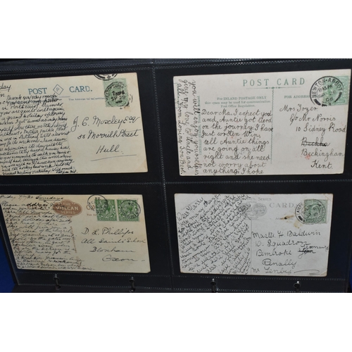 454 - TWO ALBUMS  containing 140 early-mid 20th century Postcards featuring an unusual mix of written mess... 