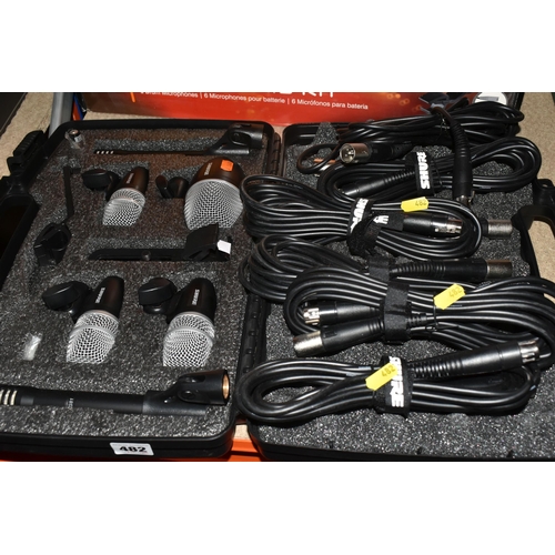 482 - A SHURE PG DRUM MIC KIT to include six microphones in original carry case and box , six XLR cables i... 