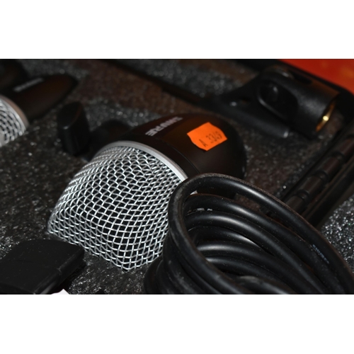 482 - A SHURE PG DRUM MIC KIT to include six microphones in original carry case and box , six XLR cables i... 