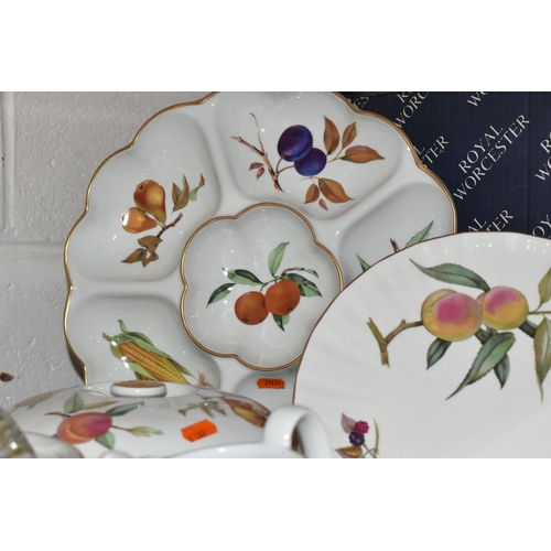 527 - FIFTY EIGHT PIECES OF ROYAL WORCESTER EVESHAM DINNER WARE, comprising a crudité dish, two oval turee... 