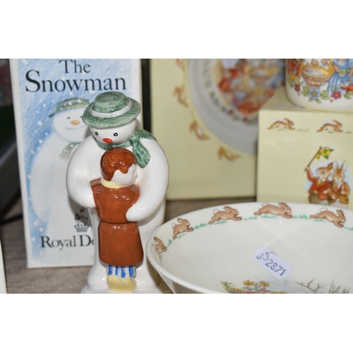 557 - A COLLECTION OF ROYAL DOULTON 'THE SNOWMAN' AND 'BUNNYKINS' GIFTWARE, comprising a boxed Walking in ... 