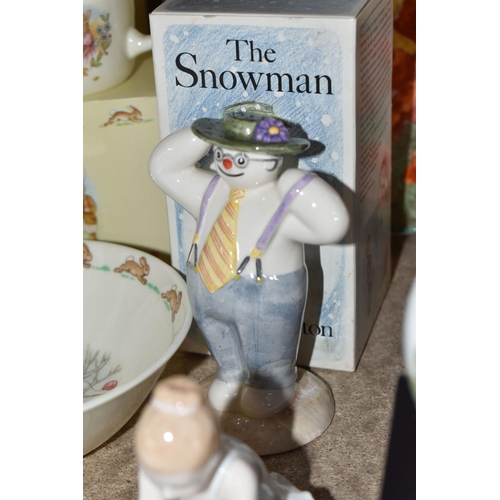 557 - A COLLECTION OF ROYAL DOULTON 'THE SNOWMAN' AND 'BUNNYKINS' GIFTWARE, comprising a boxed Walking in ... 