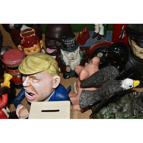579 - A BOX OF NOVELTY MONEY BOXES, to include cast iron examples of different ages, including boxes in th... 