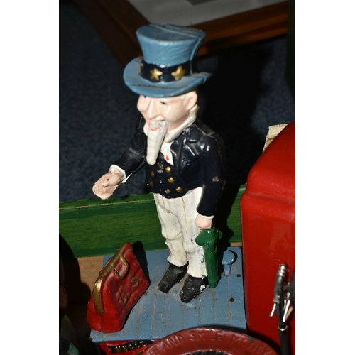 579 - A BOX OF NOVELTY MONEY BOXES, to include cast iron examples of different ages, including boxes in th... 